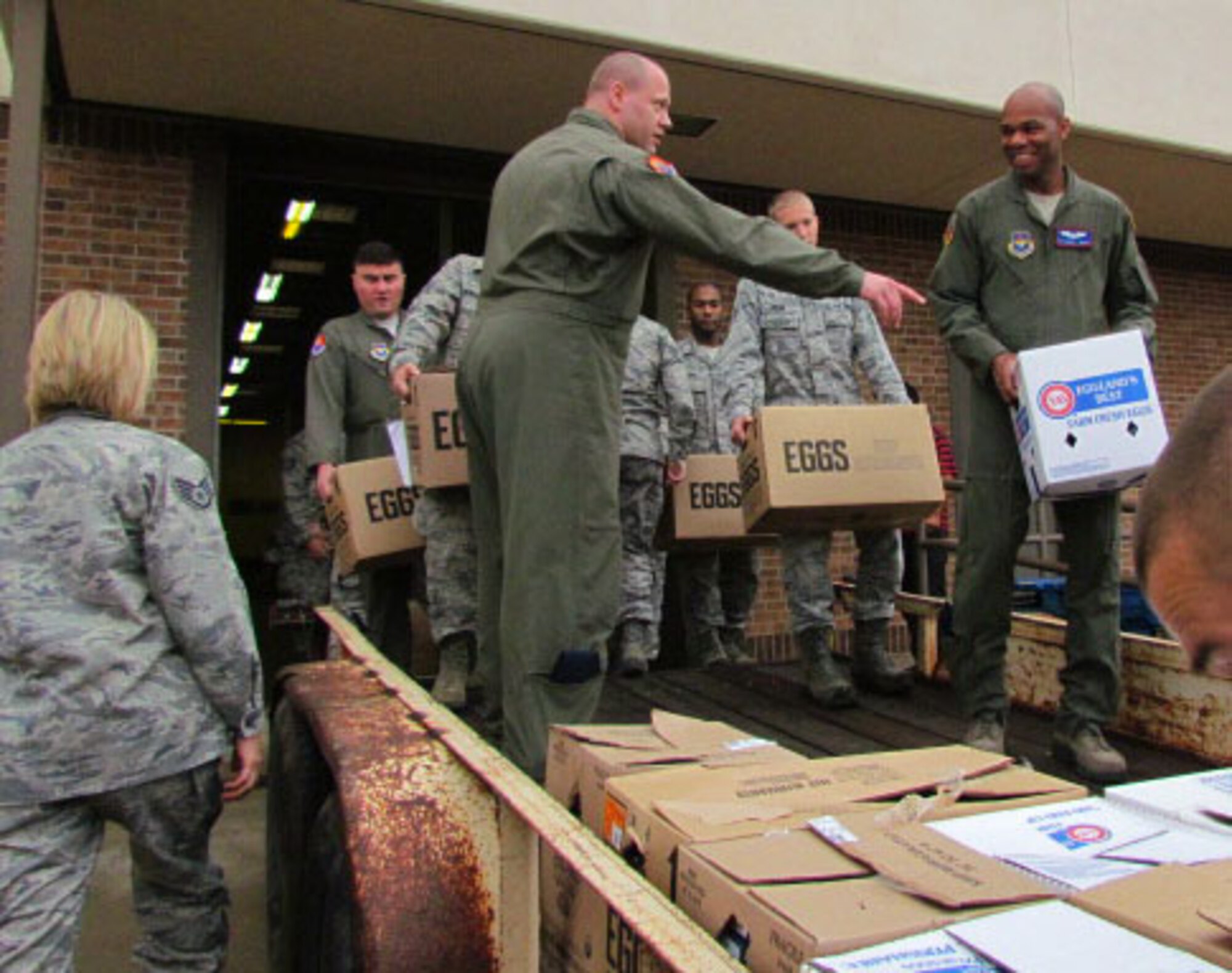 ALTUS AIR FORCE BASE, Okla. – Members of the 97th Air Mobility Wing load non-perishable goods for the Feds Feed Families food drive July 18, 2014. More than 1,700 pounds of goods have been collected so far. (Courtesy Photo/Released)