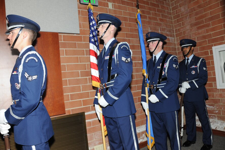 Joint Base McGuire-Dix-Lakehurst Honor Guard Airmen wait to present the colors during the Expeditionary Operations School change of command ceremony July 25, 2014. The EOS is responsible for developing and conducting Combat Airman Skills Training, mobility intelligence education, and facilitating the Air Force exercise Eagle Flag which focuses on the integration of all Expeditionary Combat Support skills. (U.S. Air Force photo by Brad Camara)