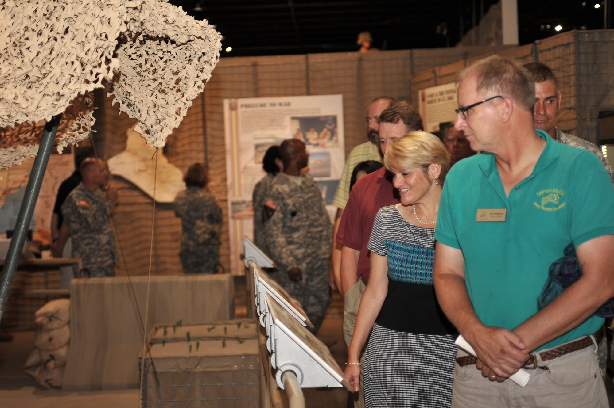 U.S. Army Transportation Museum patrons experience the newly-opened Operations Iraqi and Enduring Freedom exhibit during the museum’s ribbon-cutting ceremony at Fort Eustis, Va., July 24, 2014. The 5,000-square-foot gallery took more than 18 months to complete and features new artifacts and advanced, interactive audio and visual technologies. (U.S. Air Force photo by Staff Sgt. Katie Gar Ward/Released)