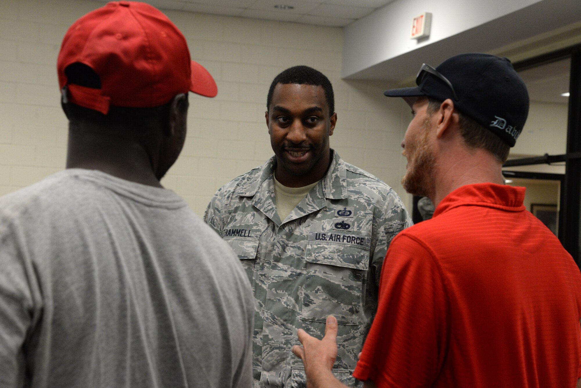 U.S. Air Force Staff Sgt. Aaron Trammell, 20th Contracting Squadron contracting administrator, speaks to attendees of the Ability One employee appreciation picnic at Shaw Air Force Base, S.C., July 25, 2014. Trammell took time to greet and thank as many employees as he could before the picnic started. (U.S. Air Force photo by Airman 1st Class Jonathan Bass/Released)