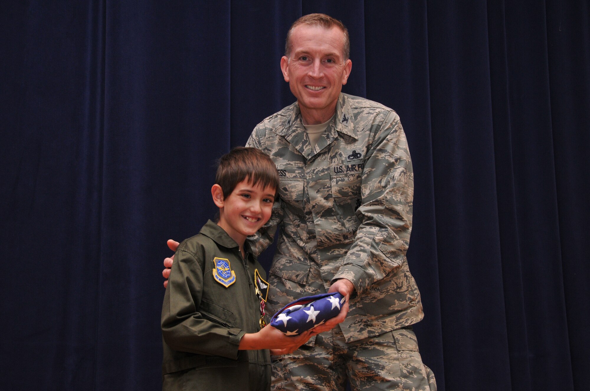 Eight year old Joey Fabus and his family were invited to the 171st Air Refueling Wing located near Pittsburgh Pa. for Joey to be Commander for a day July 17, 2014. Joey has Diffuse Intrinsic Pontine Glioma, an inoperable tumor that grows in the middle of the brainstem, his condition is terminal. Joey was sworn in as commander of the 171st from the Mission Support Group Commander Colonel Mark Goodwill. He then received his flight suit, hat, and pilot wings. From there, Joey toured the security forces section where he got to see, hands on, the different weapons the 171st uses. Joey was then given an intelligence briefing and given a scenario where he had to make a command decision. He then got a tour of one of the KC-135 R/T Stratotanker aircraft. The day ended when Joey received a medal for his bravery from 171st Maintenance Group Commander Colonel Thomas Hess.  Joey’s parents, Cindy and Dave, were awarded a center of influence medal. It has always been a dream of Joey’s to be in the Military. (U.S. Air National Guard Photo by Major Karen Bogdan/Released)