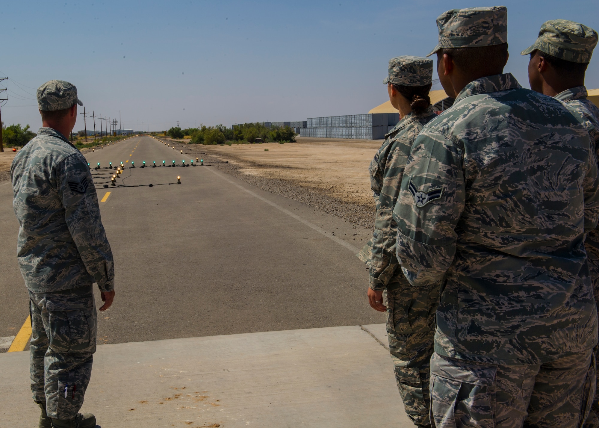 Members of Team Holloman observe a landing strip being tested during a tour at Holloman Air Force Base, N.M., July 24. The members toured Holloman’s Basic Expeditionary Airfield Resources Base unit to observe and learn about the Airmen and their mission. (U.S. Air Force photo by Airman 1st Class Leah Ferrante/Released)