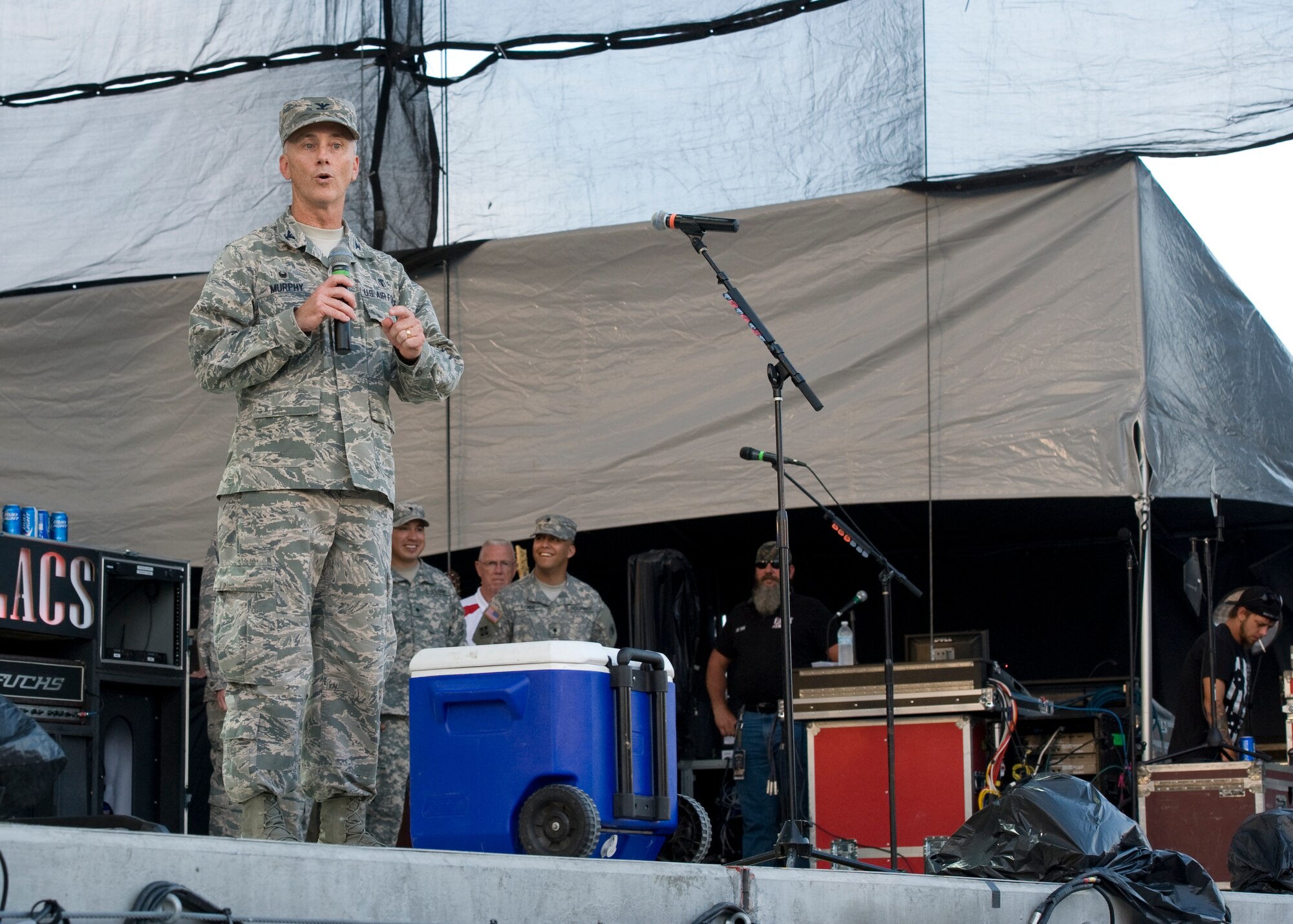Col. Kevin Murphy, 436th Medical Group commander, speaks to a large crowd prior to a Brantley Gilbert concert at the Delaware State Fair July 23, 2014, at the Delaware State Fairgrounds in Harrington, Del. Col. Murphy represented the 436th Airlift Wing at the fair on Armed Forces Day. (U.S. Air Force photo/Airman 1st Class Zachary Cacicia)
