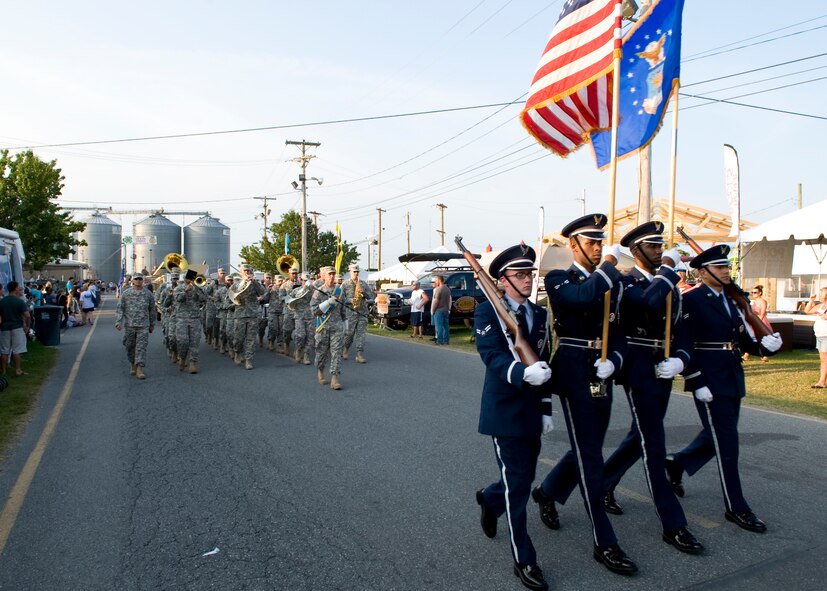 Members of the Dover Air Force Base Honor Guard head a parade at the Delaware State Fair July 23, 2014, at the Delaware State Fairgrounds in Harrington, Del. The parade took place on Armed Forces Day, where all military members were given free admission. (U.S. Air Force photo/Airman 1st Class Zachary Cacicia) 