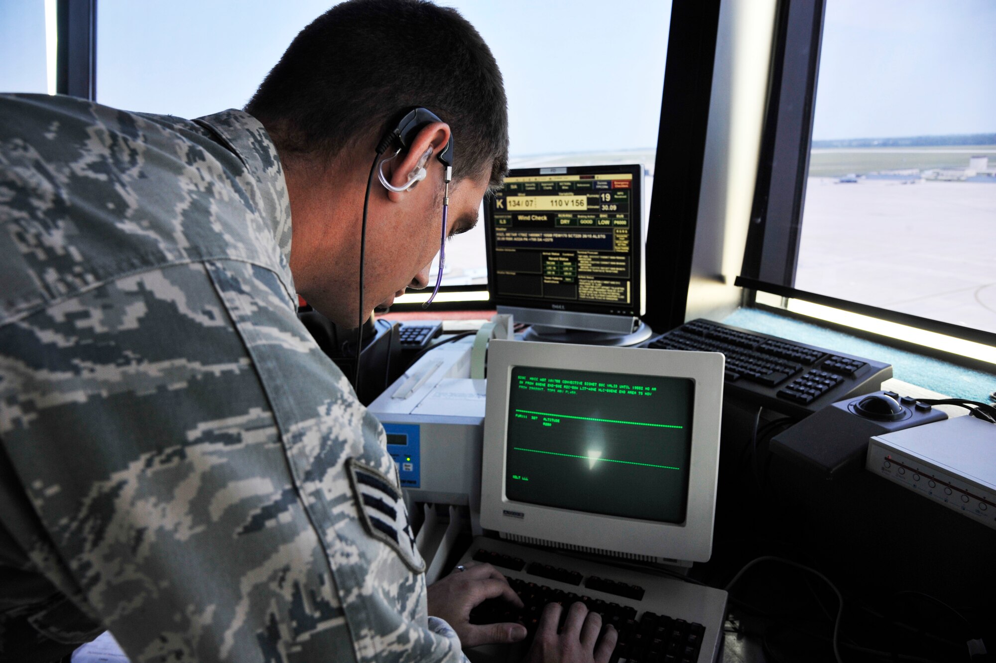 U.S. Air Force Senior Airman Craig Gephardt, 509th Operations Support Squadron air traffic controller, operates the flight data systems in the tower at Whiteman Air Force Base, Mo., July 10, 2014. The flight data systems contain flight plans for every aircraft operating within the Kansas City Center airspace. (U.S. Air Force photo by Airman 1st Class Keenan Berry/Released)