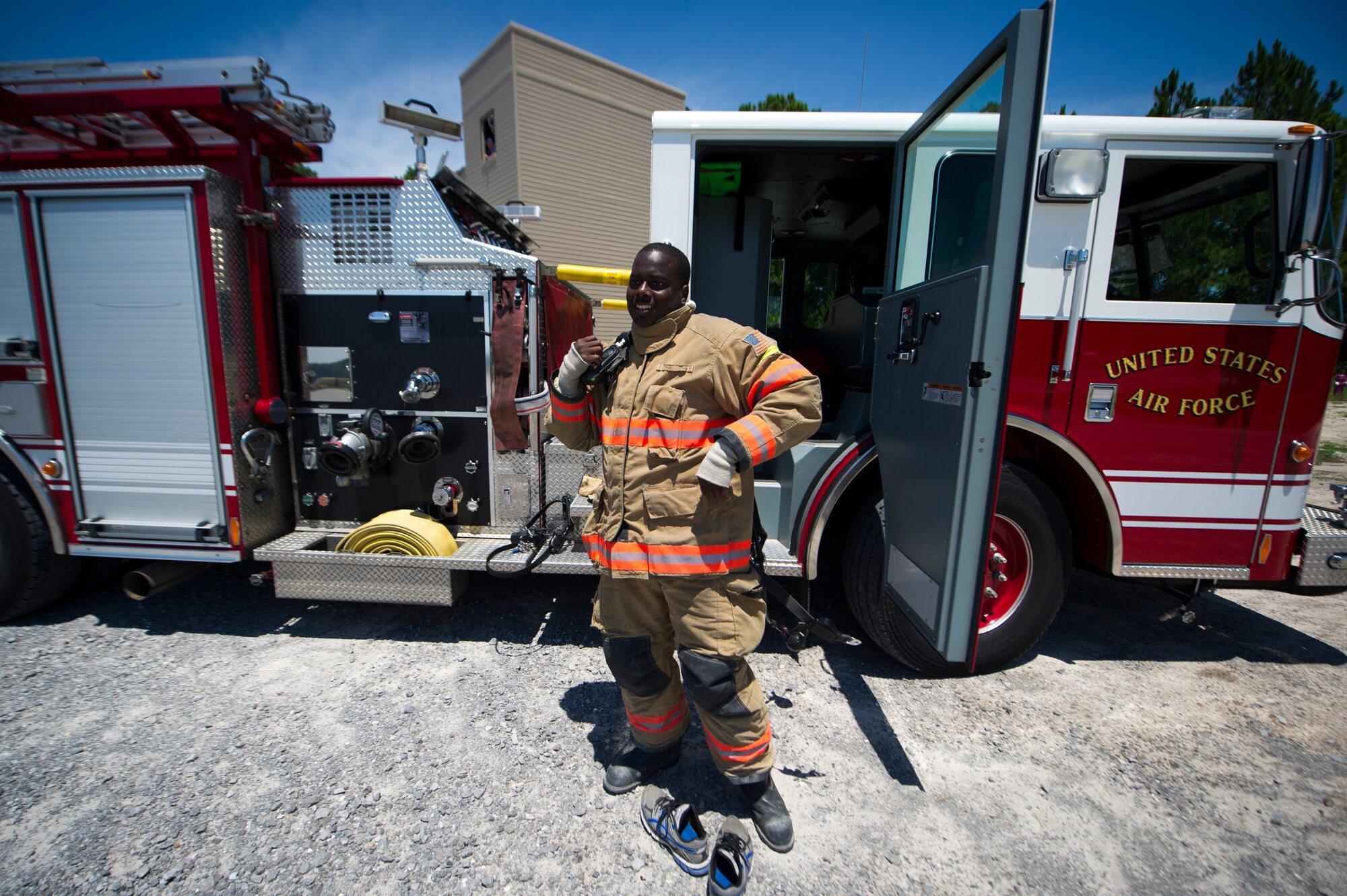 Airman 1st Class Keith Fussell, 1st Special Operations Civil Engineer Squadron firefighter, prepares his gear during training on Hurlburt Field, Fla., July 17, 2014. The two fire departments on Hurlburt worked together to conduct ventilation training. (U.S. Air Force photo/Senior Airman Christopher Callaway) 