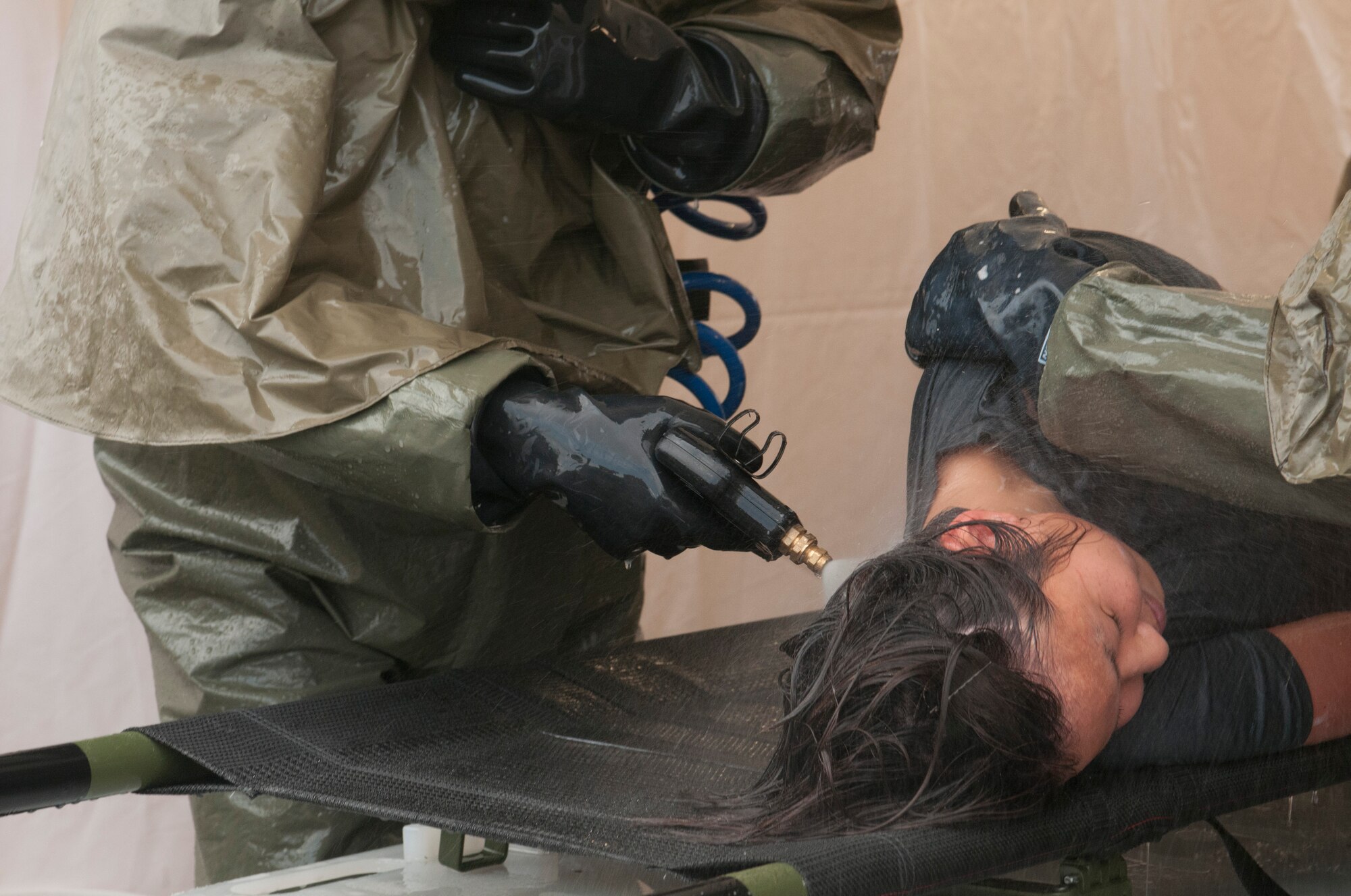 The 162nd Medical Group trains on In-Place Patient Decontamination, IPPD, July 15, 2014 at the wing medical facility. (U.S. Air National Guard photo by Senior Airman Gregory Ferreira/Released)