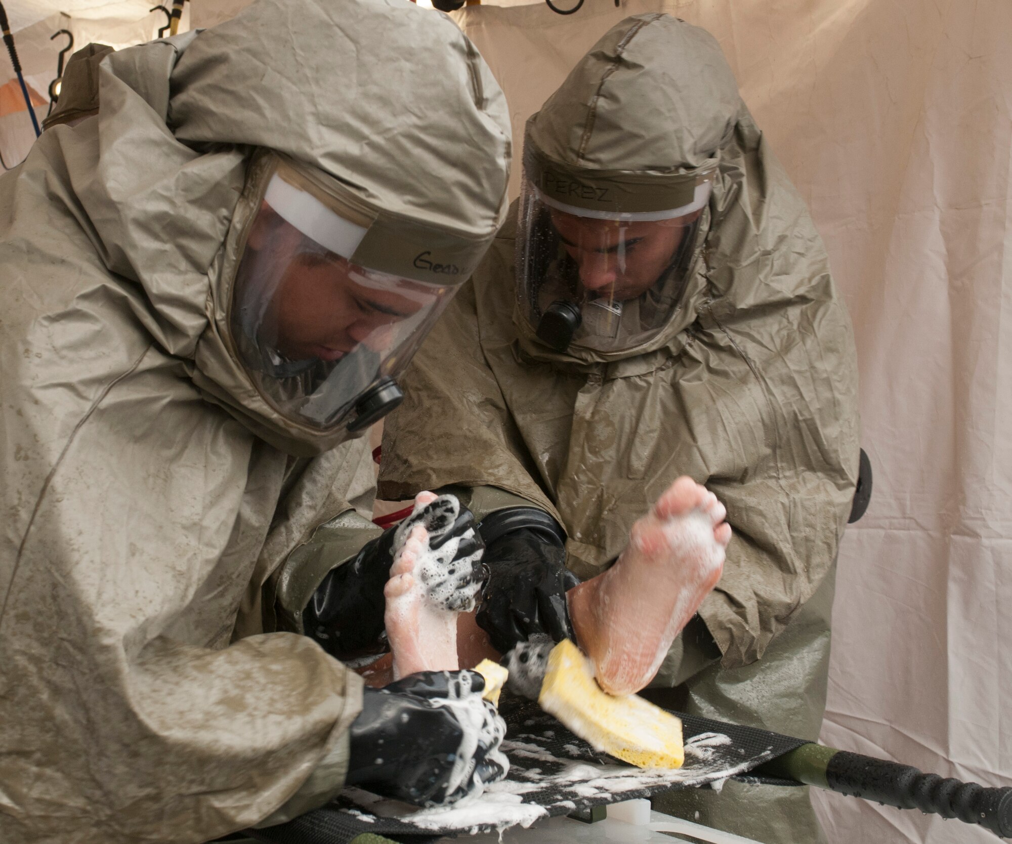 The 162nd Medical Group trains on In-Place Patient Decontamination, IPPD, July 15, 2014 at the wing medical facility. (U.S. Air National Guard photo by Senior Airman Gregory Ferreira/Released)