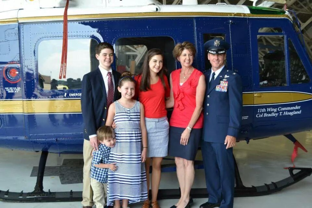 Col. Brad Hoagland poses with his wife, Jill, and their four kids at the 11th Wing change of command ceremony at Hangar 3, Joint Base Andrews, Md., July 14, 2014. Hoagland was previously the 386th Air Expeditionary Wing’s vice commander in Southwest Asia. (Courtesy photo)