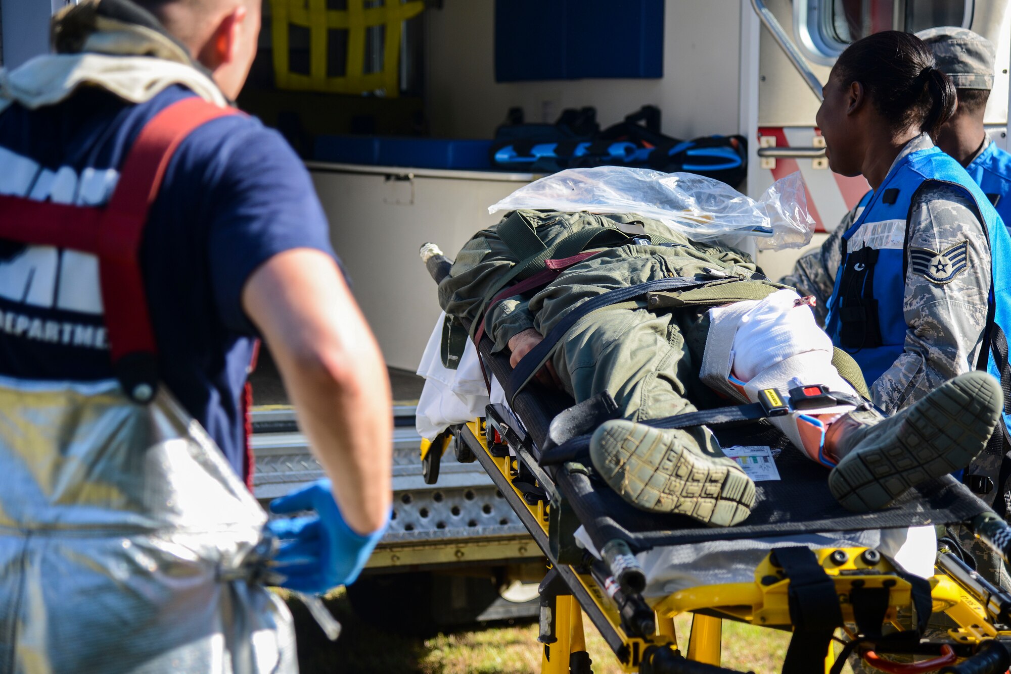 First responders from the City of Hampton and Joint Base Langley-Eustis participate in an exercise at Langley Air Force Base, Va., July 25, 2014. The exercise tested personnel’s abilities in notification, response and recovery actions in the event of an off-base aircraft crash. (U.S. Air Force photo by Senior Airman Kayla Newman/Released)  