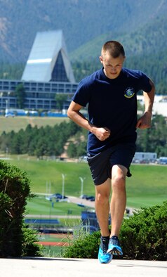 Airman 1st Class Dylan MacDermot trains Wednesday at the Academy for the 2014 Air Force marathon at Wright-Patterson AFB, Ohio, in September. He hopes to raise $2,500 for the Air Force Enlisted Village. (U.S. Air Force photo/Master Sgt. Kenneth Bellard)