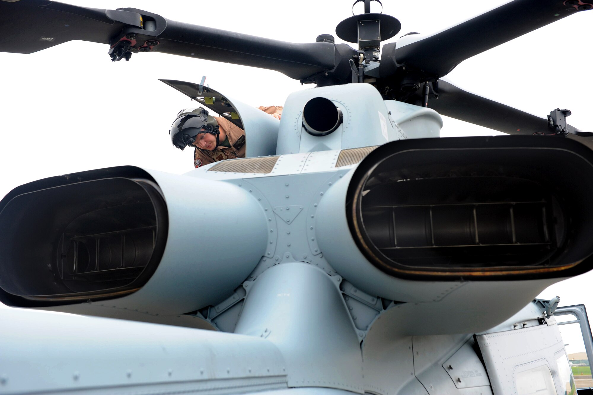 Marine Capt. Brett Keller, pilot, performs pre-flight inspections on a UH-1Y helicopter July 22. The aircraft will be used to conduct local terrain flight operations above a recently-approved route. (U.S. Air Force photo by Tommie Horton)