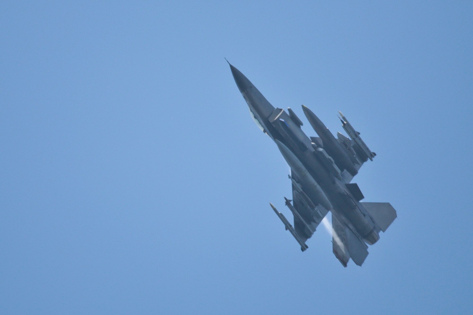 A picture of a U.S. Air Force F-16C Fighting Falcon flying over the Grafenwoehr Training Area.