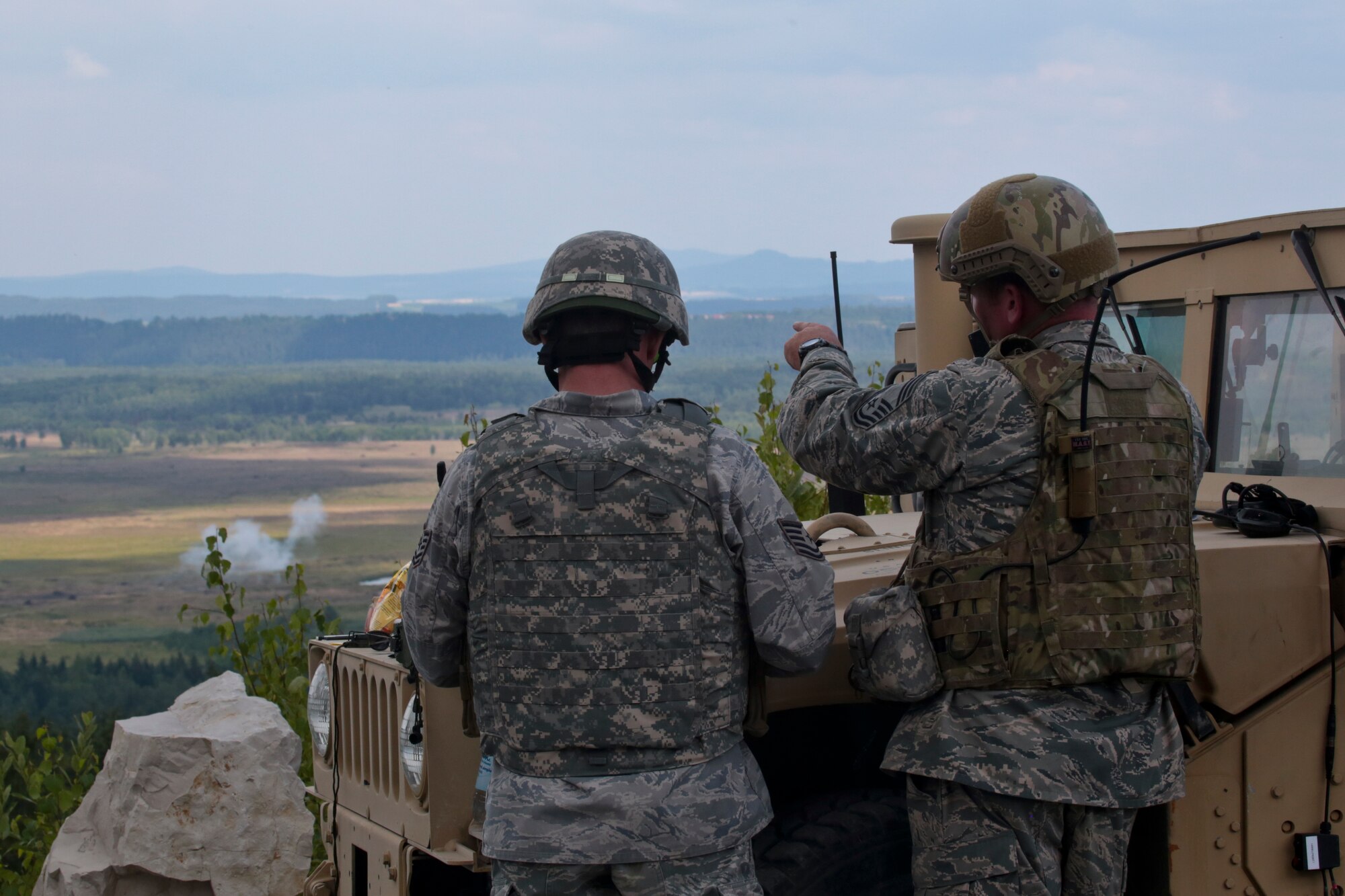 A picture of U.S. Air Force Chief Master Sgt. Robert Zaniewski pointing out a direct hit to Tech. Sgt. Jack Baum.