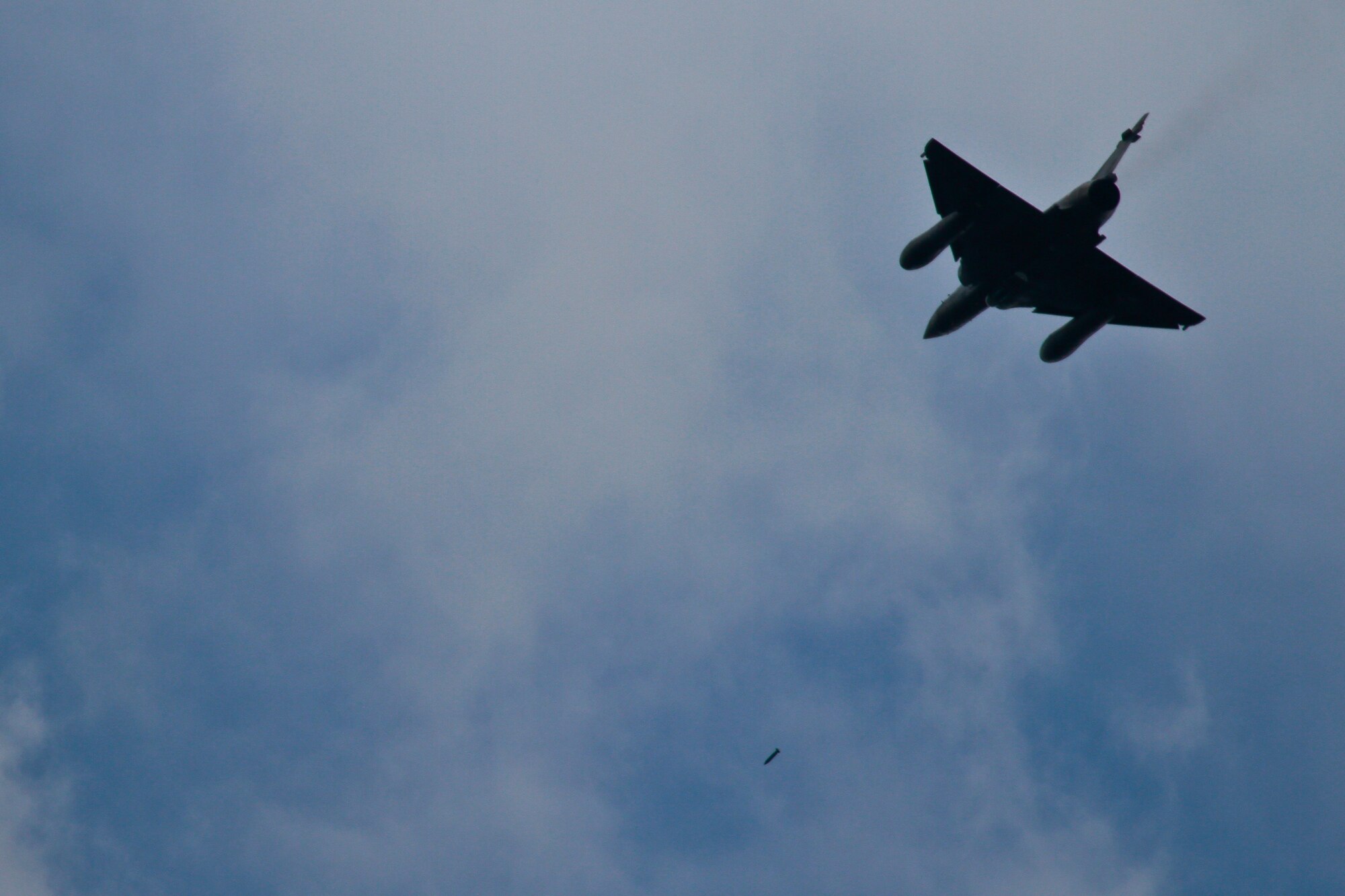 A picture of a French Air Force Mirage 2000 dropping munitions over Grafenwoehr Training Area.