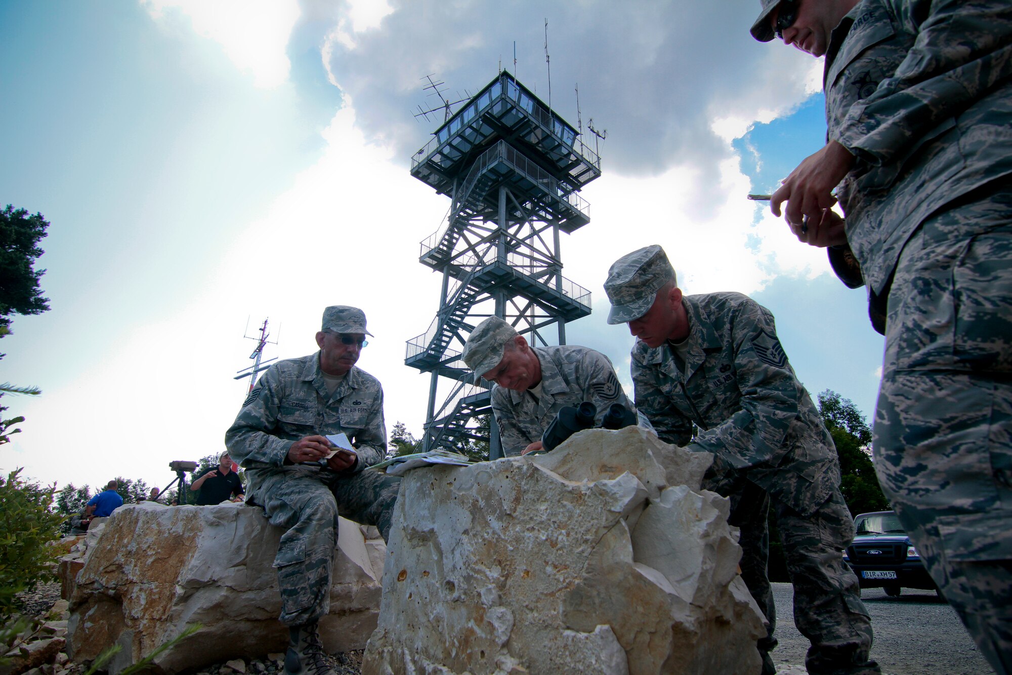 A picture of U.S. Air Force Airmen from the New Jersey Air National Guard's 177th Security Forces Squadron receiving map and compass training from tactical air control party specialists.