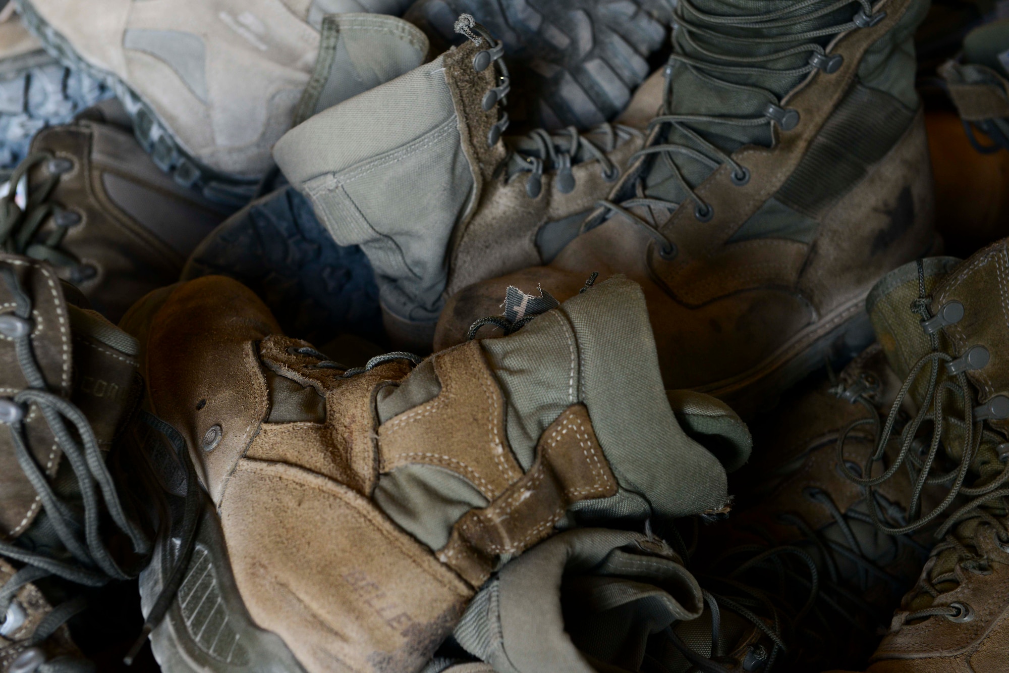 Worn and unserviceable boots and uniform items can be discarded at 15 uniform drop box locations on Al Udeid Air Base, Qatar. All uniforms to include Airman Battle Uniform blouses, pants, hats, tan shirts, physical training shorts and shirts, as well as all respective items from the Army, Marines and the Navy can be dropped off at one of the locations. (U.S. Air Force photo by Staff Sgt. Ciara Wymbs)