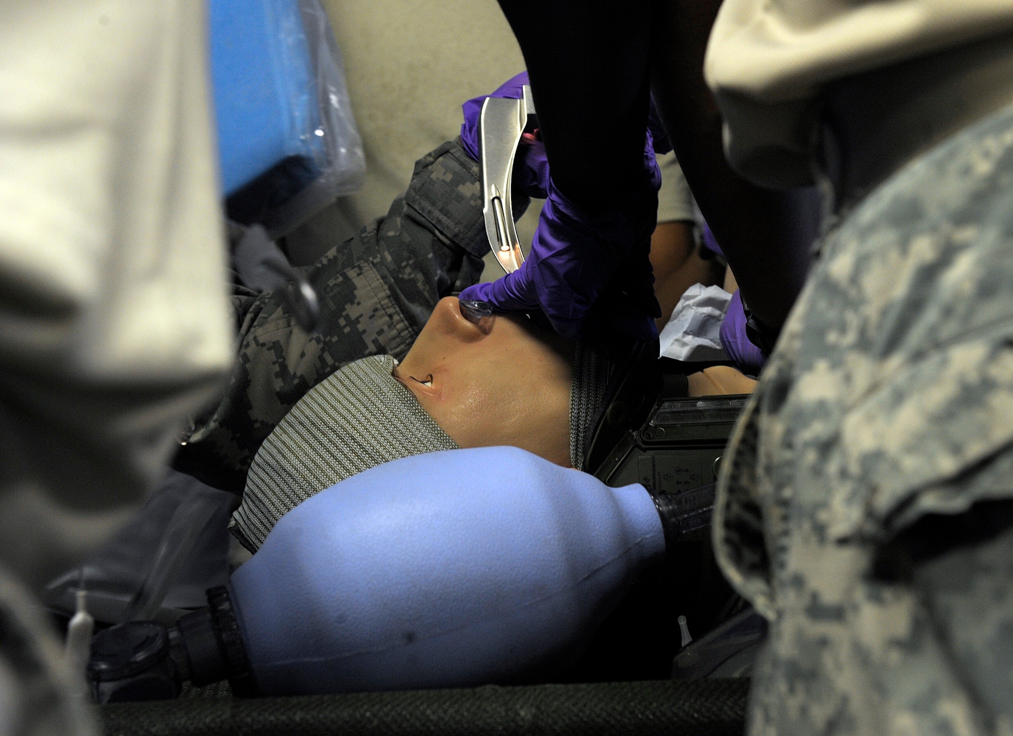 U.S. Army Maj. Janice Daniel, 160th Forward Surgical Team certified registered nurse anesthetist, intubates a training dummy during a joint FST training at Ramstein Air Base, Germany, July 18, 2014. Members of the 86th Medical Group tactical critical care evacuation team-enhanced and the 160th FST trained together to increase their interoperability. (U.S. Air Force photo/Senior Airman Timothy Moore)