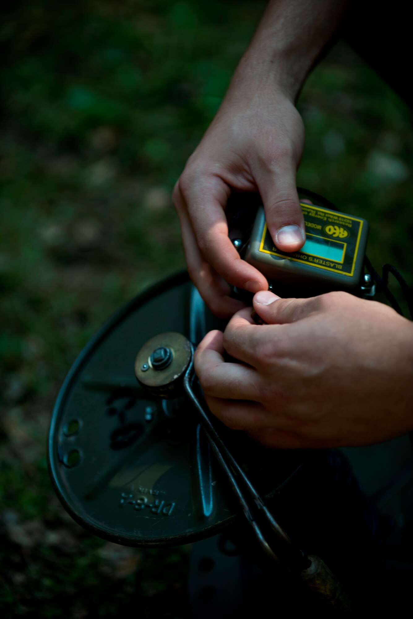 Airman 1st Class Tyler Hatfield, 886th Civil Engineer Squadron explosive ordnance disposal technician, checks the current of a trigger used to detonate explosives during training June 26, 2014, at Ramstein Air base, Germany. The Ramstein EOD Airmen provides support to three wings, 26 geographically separated units and two U.S. Army brigades. (U.S. Air Force photo/ Senior Airman Jonathan Stefanko)