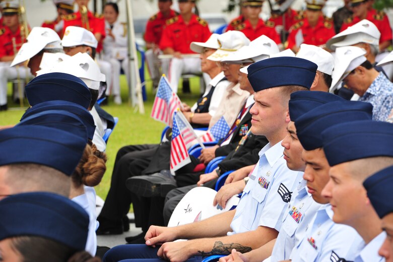 Airmen from the 8th Fighter Wing at Kunsan Air Base, sit alongside Korean War veterans during an Armistice Agreement anniversary ceremony at Imsil National Cemetery, Republic of Korea, July 22, 2014. Approximately 29 Airmen attended the event as representatives of the wing, after being invited to take part by the ROK Ministry of Patriots and Veterans Affairs. (U.S. Air Force photo by 1st Lt. Earon Brown/Released)