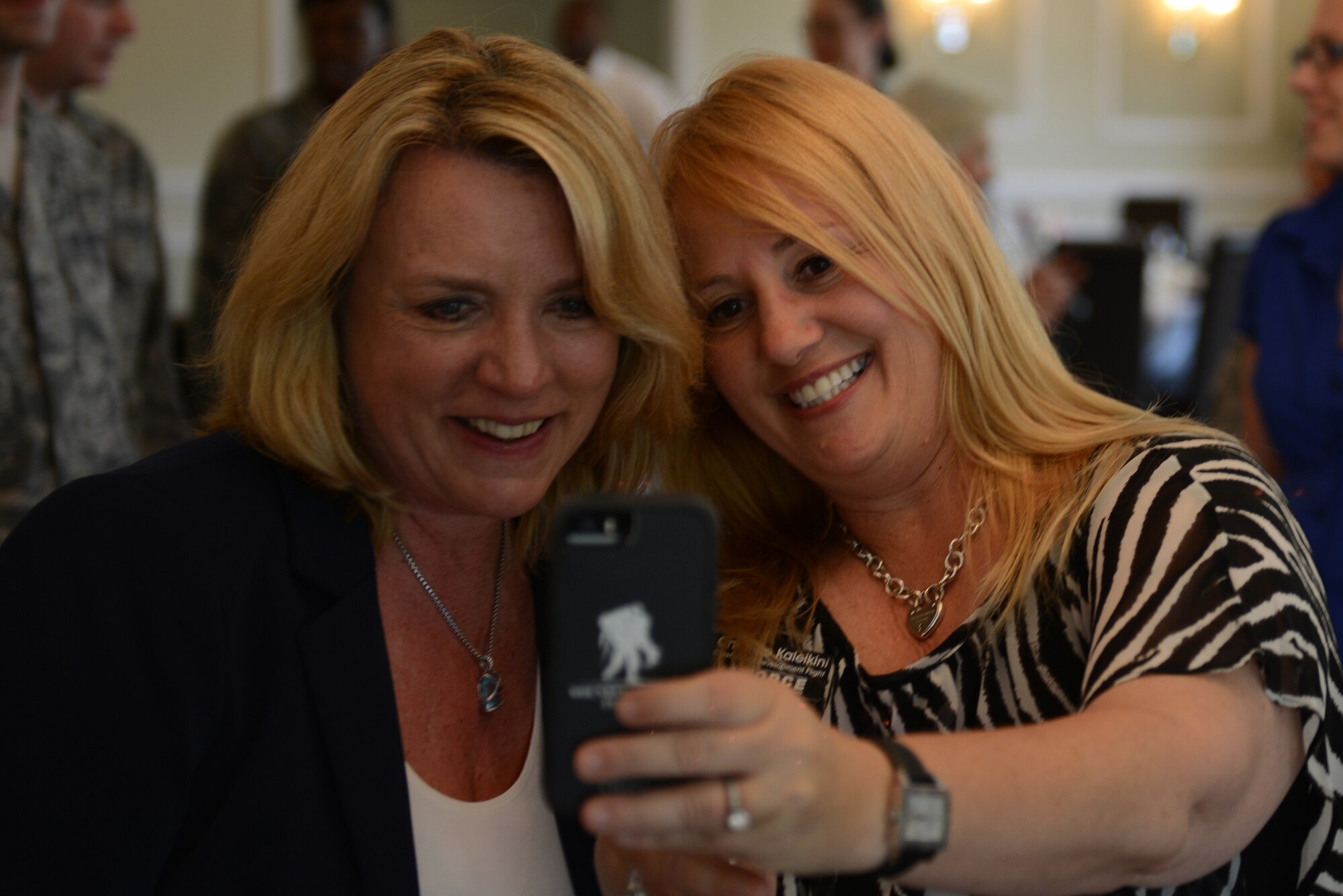 Secretary of the Air Force Deborah Lee James takes a selfie with Christine Kaleikini, 423rd Air Base Squadron, at RAF Alconbury, United Kingdom, July 17, 2014. James emphasized the Air Force is powered by the Total Force, which includes active duty, National Guard, Reserve and civilian employees. (U.S. Air Force photo by Tech. Sgt. Chrissy Best)