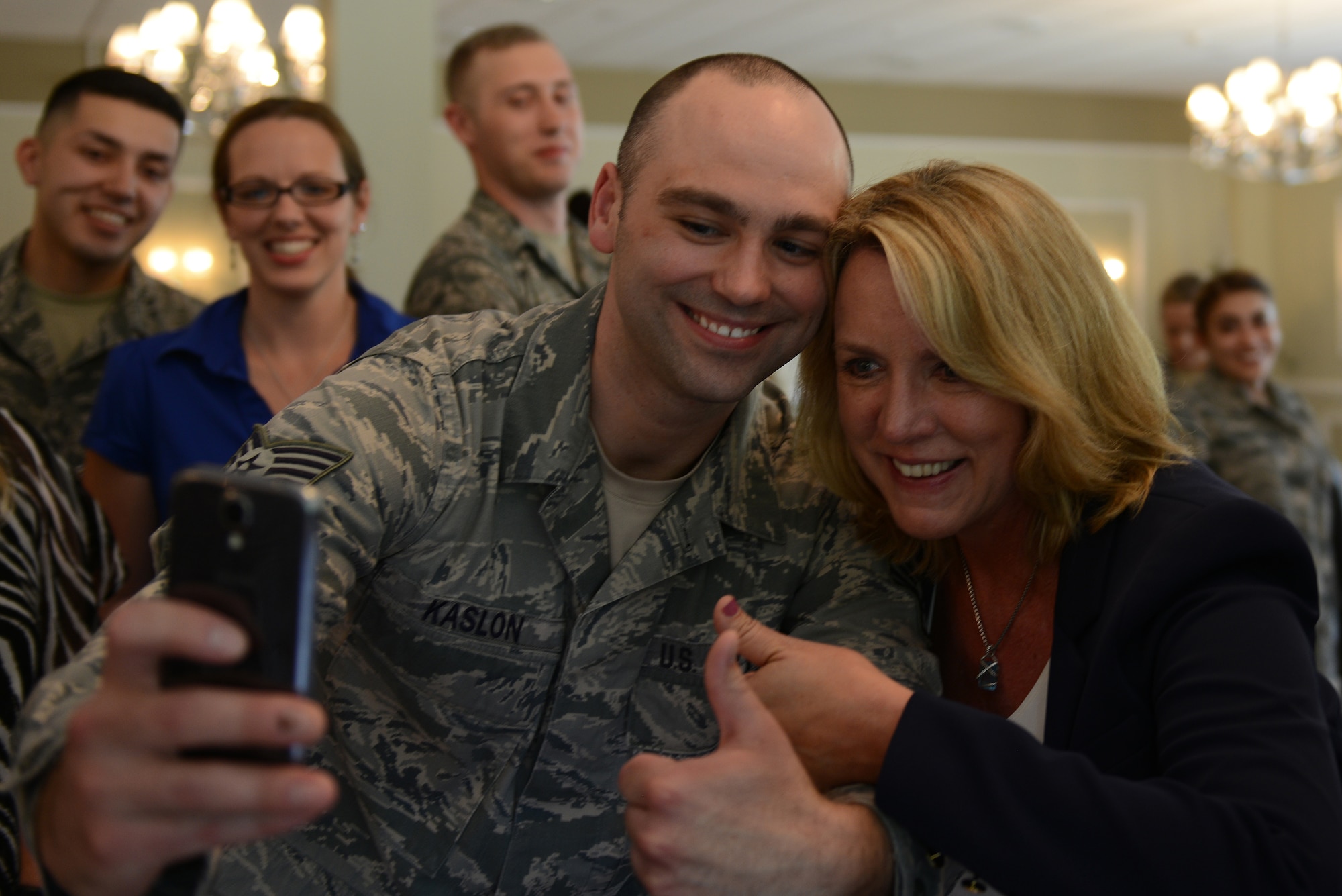 Secretary of the Air Force Deborah Lee James takes a selfie with Staff Sgt. Derick Kaslon, 421st Air Base Squadron, at RAF Alconbury, United Kingdom, July 17, 2014. James visited the 501st CSW, to talk about her priorities and learn firsthand how each Airman contributes the wing’s mission. (U.S. Air Force photo by Tech. Sgt. Chrissy Best)