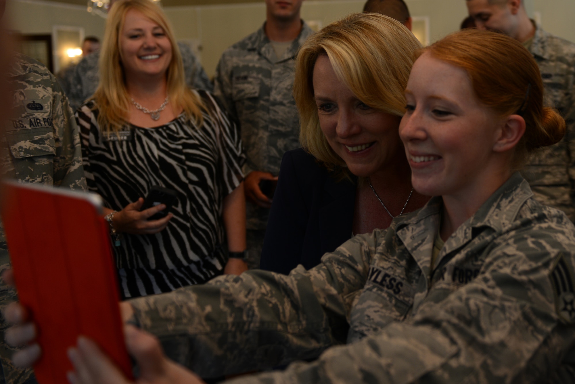 Secretary of the Air Force Deborah Lee James takes a selfie with Senior Airman Sarah Bayless, 422nd Communication Squadron, radio frequency transmission system technician, at RAF Alconbury, United Kingdom, July 17, 2014. During the Secretary’s visit with the 501st Combat Support Wing, she was briefed on the wing’s mission, enabling communications and the medical capabilities the wing provides to support its populace. (U.S. Air Force photo by Tech. Sgt. Chrissy Best)