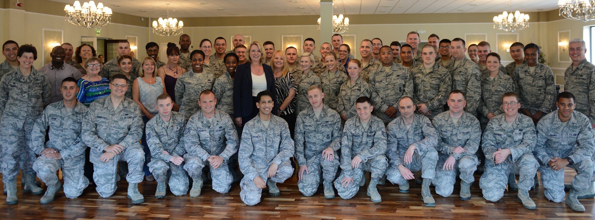 Secretary of the Air Force Deborah Lee James poses for a group photo with Airman of the 501st Combat Support Wing, during her visit to RAF Alconbury, United Kingdom, July 17, 2014. (U.S. Air Force photo by Tech. Sgt. Chrissy Best)