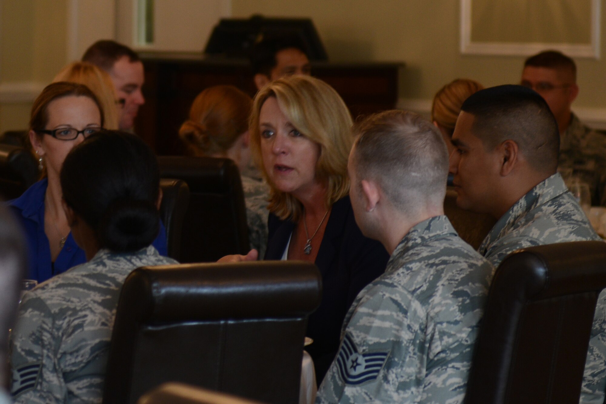 Secretary of the Air Force Deborah Lee James speaks with Airmen from the 501st Combat Support Wing at lunch at RAF Alconbury, United Kingdom, during her visit to the UK, July 17, 2014. James visited the 501st CSW to talk about her priorities and learn about the 501st CSW mission from the Airmen who drive it. (U.S. Air Force photo by Tech. Sgt. Chrissy Best)