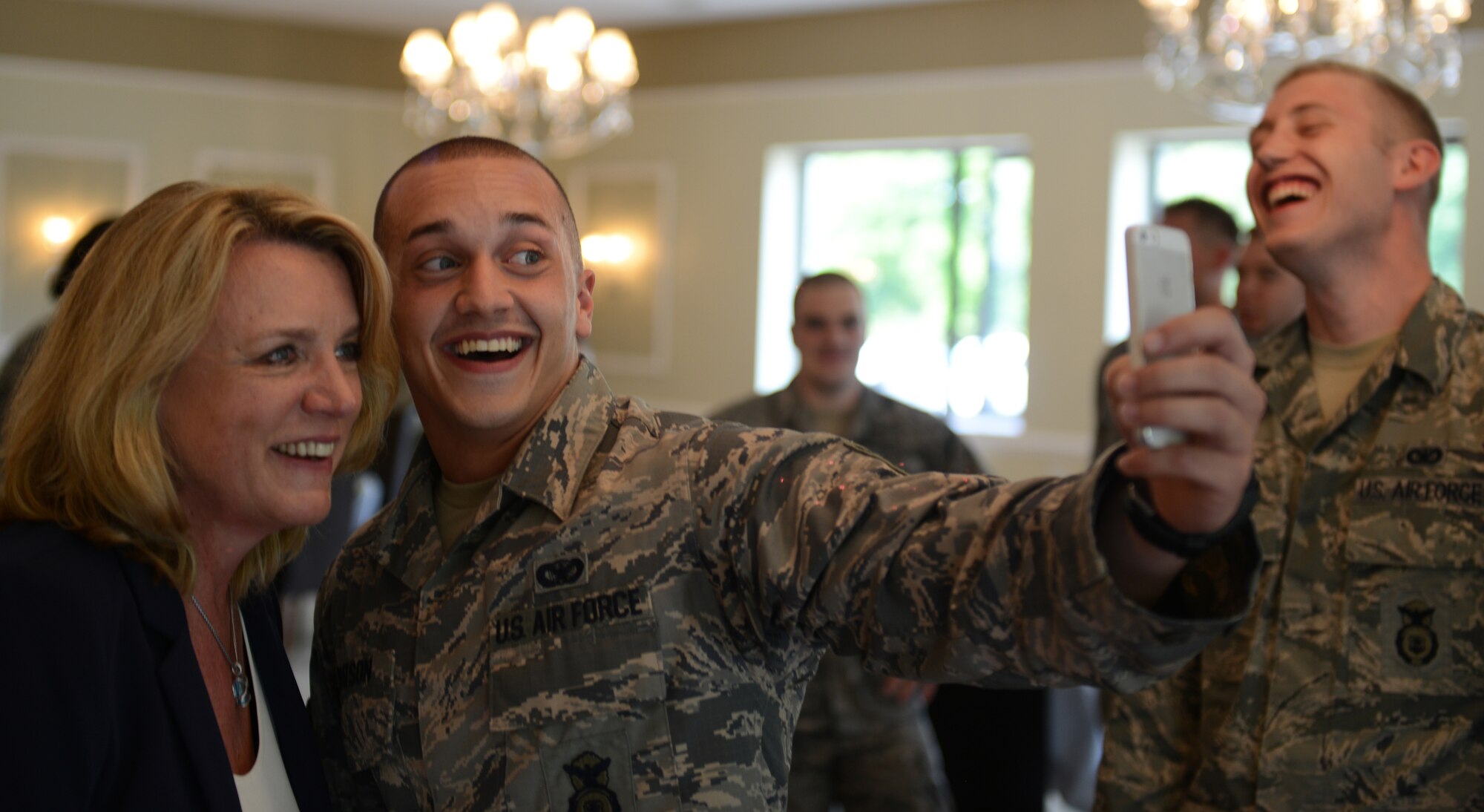 Secretary of the Air Force Deborah Lee James takes a selfie with Staff Sgt. Ryan Watson, 501st Combat Support Wing, command chief executive, at RAF Alconbury, United Kingdom, July 17, 2014. James offers to take selfies with the Airmen she meets at installations she visits.  (U.S. Air Force photo by Tech. Sgt. Chrissy Best)