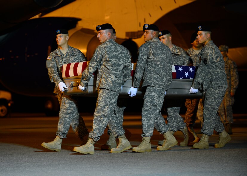 A U.S. Army carry team transfers the remains of Pfc. Keith M. Williams of Visalia, Calif., July 26, 2014, at Dover Air Force Base, Del. Williams was assigned to the 1st Battalion, 12th Infantry Regiment, 4th Infantry Brigade Combat Team, 4th Infantry Division, Fort Carson, Colo. (U.S. Air Force photo/Airman 1st Class William Johnson)