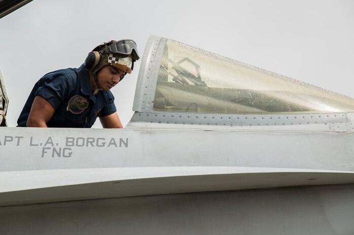 A maintenance Marine with Marine Fighter Attack Squadron 122 washes an F/A-18C Hornet during routine maintenance aboard Marine Corps Base Hawaii, July 21, 2014. Marine Fighter Attack Squadron 122 is in Hawaii for Rim of the Pacific Exercise 2014, a multinational maritime exercise hosted by the U.S. Pacific Fleet and provides realistic training that increases participants’ abilities to plan, communicate and conduct complex maritime operations.