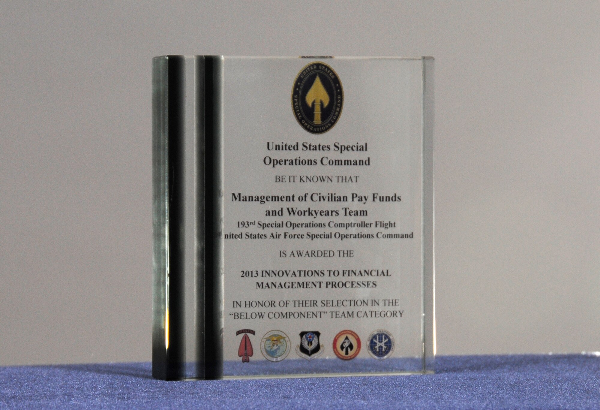 Airmen of the 193rd Special Operations Wing Comptroller Flight and Human Resources remote office were presented this U.S. Southern Command 2013 Innovations to Financial Management Process-Civilian Pay Manpower Team award during commander’s call, July 27. The Comptroller and HRO remote team worked together to coordinate and track personnel action that involved work year execution resulting in on time and on target work year execution rates and ensuring the Wing was audit ready, which resulted in the team earning this award. (U.S. Air National Guard photo by Senior Master Sgt. David Hawkins) 
