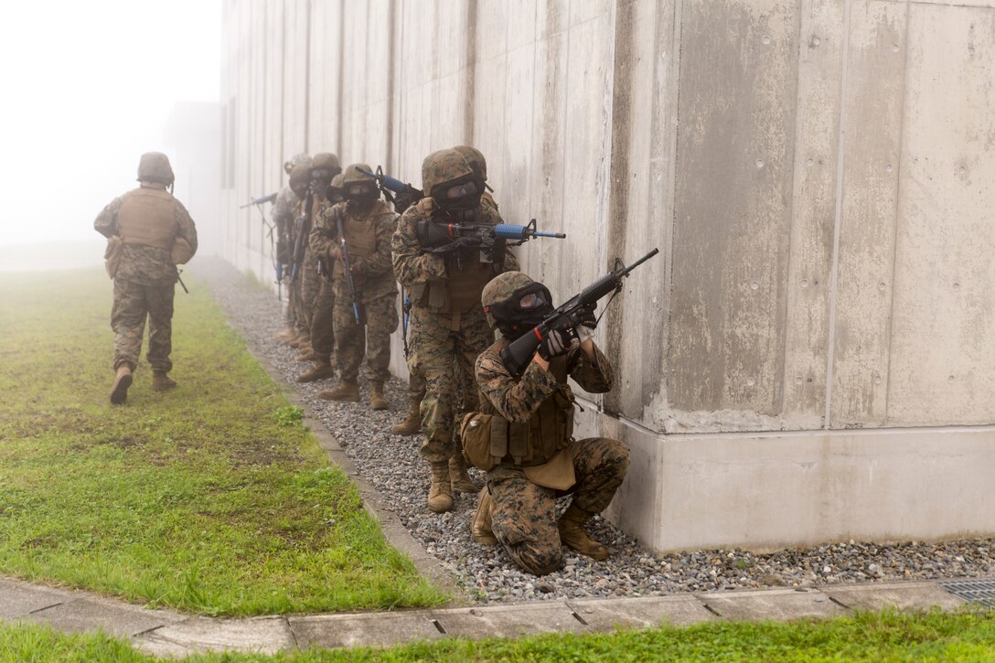 Combat Logistics Company 36 Marines and augments post security during Military Operations on Urban Terrain training as a part of Exercise Dragon Fire 2014 at Combined Arms Training Center Camp Fuji, Japan, July 17. Dragon Fire is CLC-36’s annual Battle Skills Training exercise that focuses on improving the individual and collective combat skills of CLC-36 service members with an emphasis on weapons familiarization training.