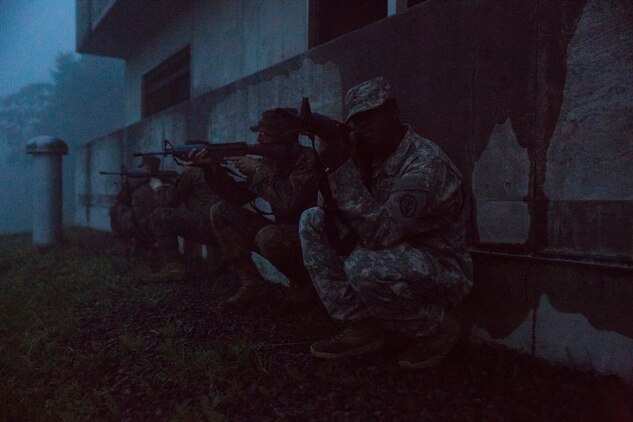 Combat Logistics Company 36 Marines and augments post security during Military Operations on Urban Terrain training as a part of Exercise Dragon Fire 2014 at Combined Arms Training Center Camp Fuji, Japan, July 17. Dragon Fire is CLC-36’s annual Battle Skills Training exercise that focuses on improving the individual and collective combat skills of CLC-36 service members with an emphasis on weapons familiarization training.