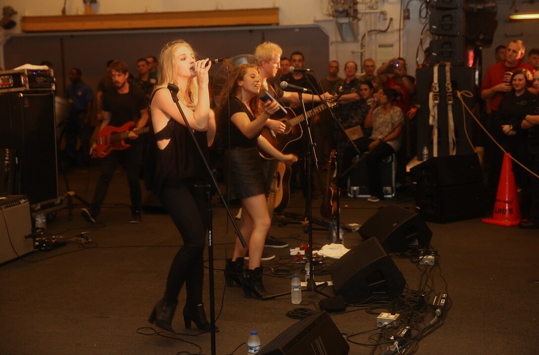 U.S. 5TH FLEET AREA OF RESPONSIBILITY (July 25, 2014) Folk rock band Delta Rae performs a live concert for U.S. Marines and U.S. Navy Sailors aboard the multi-purpose amphibious assault ship USS Bataan (LHD 5). The Bataan is the flagship for the Bataan Amphibious Ready Group and, with the embarked 22nd Marine Expeditionary Unit, is deployed in support of maritime security operations and theater security cooperation efforts in the U.S. 5th Fleet area of responsibility. (U.S. Marine Corps photo by Cpl. Caleb McDonald/Released)