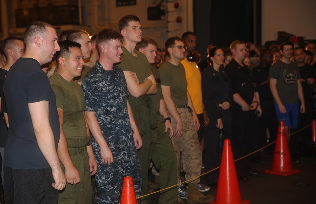 U.S. 5TH FLEET AREA OF RESPONSIBILITY (July 25, 2014) U.S. Marines with the 22nd Marine Expeditionary Unit (MEU) and U.S. Navy Sailors with the multi-purpose amphibious assault ship USS Bataan (LHD 5) enjoy a live concert aboard the Bataan. The 22nd MEU is deployed with the Bataan Amphibious Ready Group as a theater reserve and crisis response force throughout U.S. Central Command and the U.S. 5th Fleet area of responsibility. (U.S. Marine Corps photo by Cpl. Caleb McDonald/Released)
