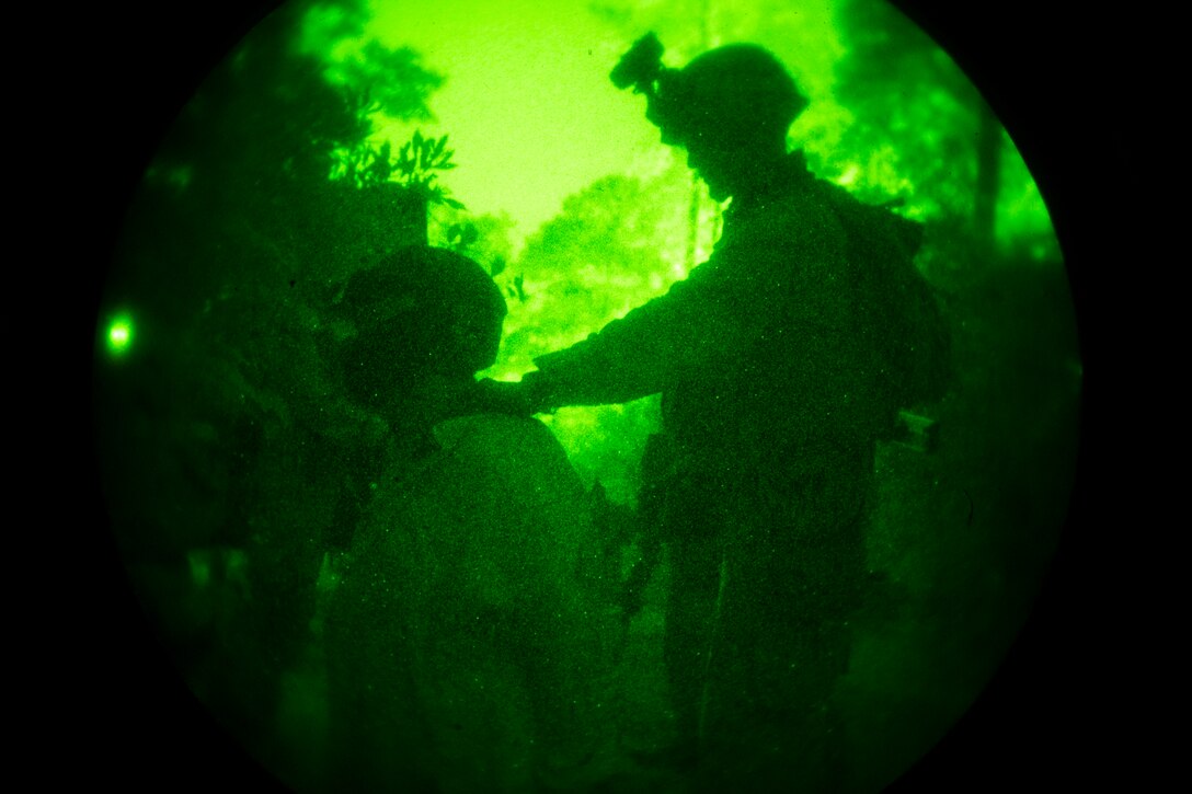 A Marine with Lima Company, Battalion Landing Team 3rd Battalion, 6th Marine Regiment, 24th Marine Expeditionary Unit, controls a simulated detainee during a nighttime raid exercise at Camp Lejeune, N.C., July 27, 2014. The 24th MEU is currently conducting Realistic Urban Training, the unit’s first major pre-deployment exercise in preparation for their deployment at the end of the year. (U.S. Marine Corps photo by Cpl. Todd F. Michalek)