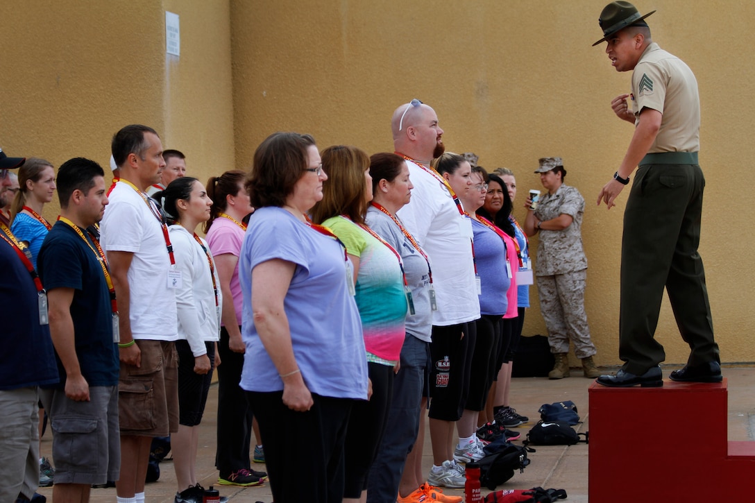 Educators and community influencers from Recruiting Station Salt Lake City and RS San Francisco learn about and get a first-hand experience of Marine Corps recruit training as part of an Educator's Workshop at Marine Corps Recruit Depot San Diego, July 22, 2014. The educators and community leaders are given the chance to learn about the transition from civilian to Marine and what is expected of a Marine on a day-to-day basis to better understand what the Marine Corps can offer for a transitioning young man or woman. (U.S. Marine Corps photo by Sgt. Daniel Wetzel) 
