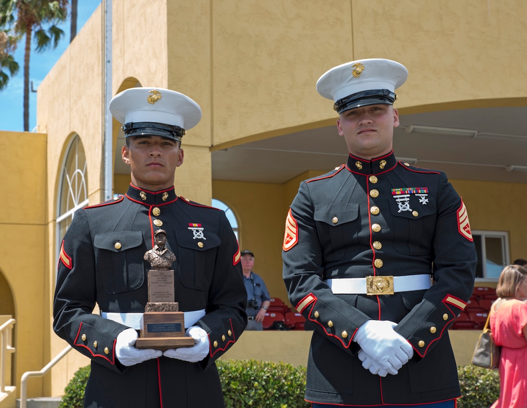 U.S. Marine Corps Pfc. Daniel J. Slack, left, honor graduate, native of Oregon City, OR., and Staff Sgt. Nicholas A. Weber, right, recruiter, RSS Oregon City, RS Portland, 12th Marine Corps District, stand together after graduation aboard Marine Corps Recruit Depot, San Diego, July 18, 2014. Slack graduated boot camp as the Company E Honorman, a title only one Marine from each cycle can earn.