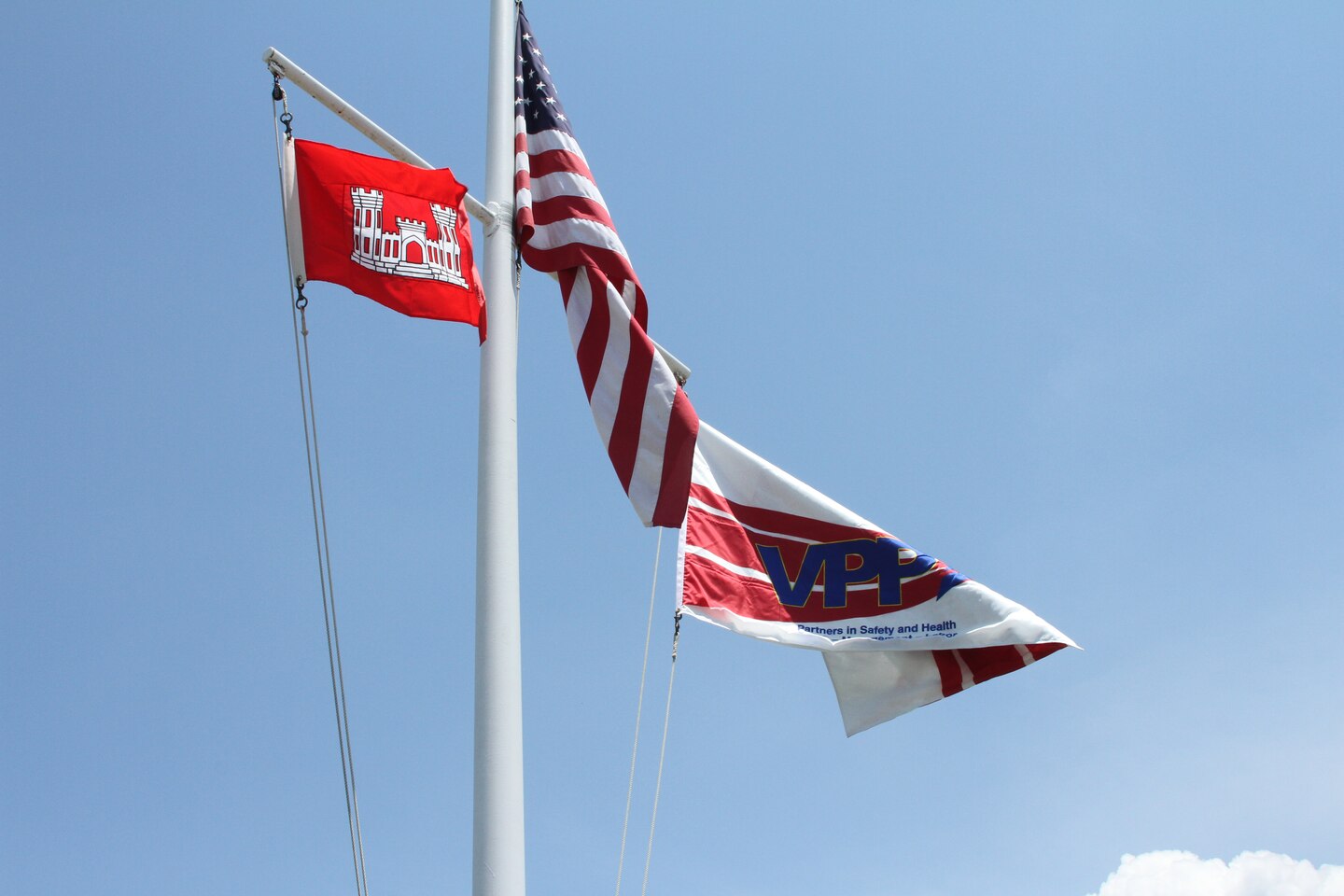 After five years of building a world-class safety and health management program, the staff of the Craney Island Dredged Material Management Area proudly display the coveted VPP Star flag. 