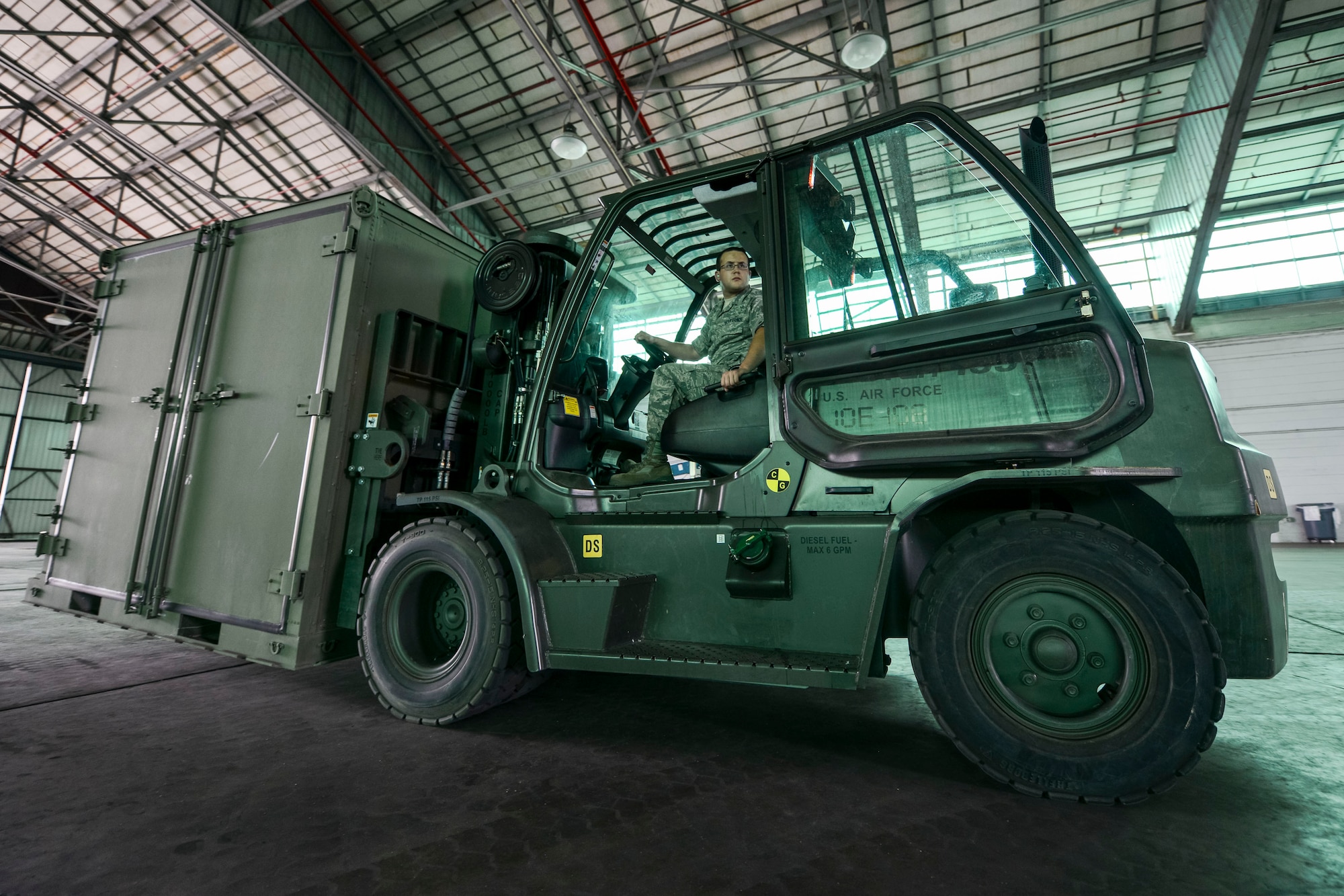 U.S. Air Force Staff Sgt. Robert Nine, assigned to the 169th Communications Flight, drives a 10k standard forklift during forklift driver training at the Combat Readiness Training Center in Savanah, Ga., July 16, 2014. Nine and more than 180 Airmen from the 169th Fighter Wing, traveled to the CRTC to conduct their annual training. The CRTC offered the Airmen a place to train and complete yearly ancillary training away from their home station.  (U.S. Air National Guard photo by Tech. Sgt. Jorge Intriago/Released)