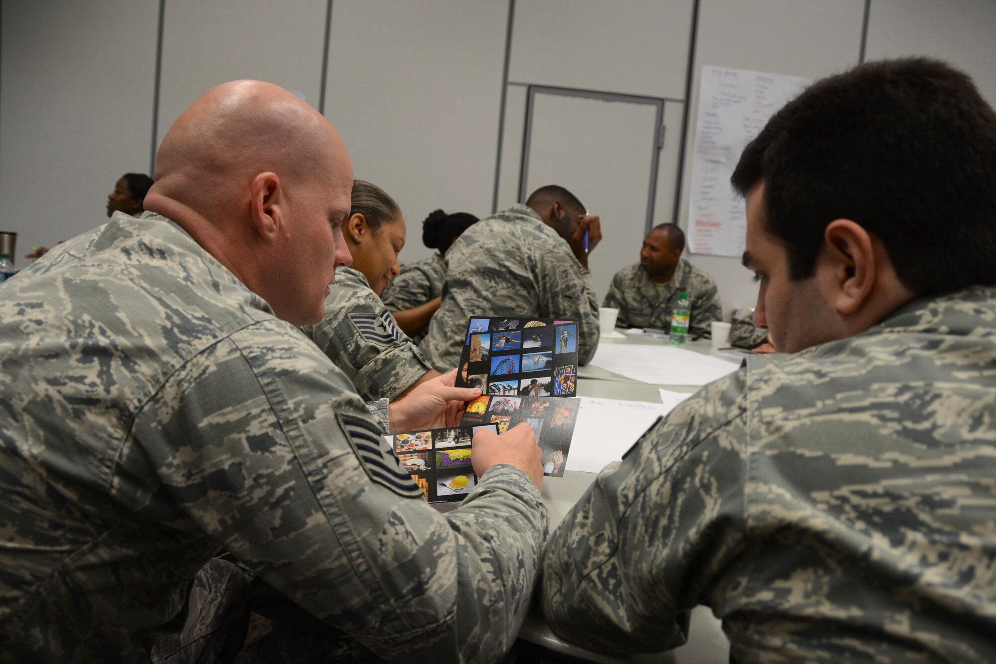 U.S. Airmen, assigned to the 169th Fighter Wing, attend a Four Lenses personality-type indicator assessment, during annual training at the Combat Readiness Training Center in Savannah, G.a., July 16, 2014.  This training experience has allowed Airmen to meet their annual requirements outside of the unit training assembly weekend throughout the year.  (U.S. Air National Guard photo by Tech. Sgt. Jorge Intriago/Released)