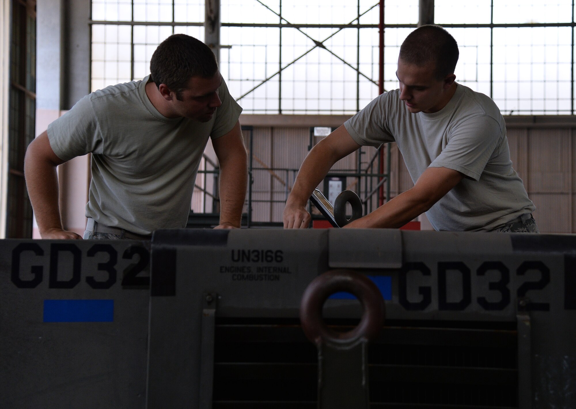 Staff Sgt. Joel Morris and Senior Airman Colton Russell, 15th Maintenance Squadron C-17 Globemaster Aerospace Ground Equipment, put final touches on a newly repaired power cart generator at Joint Base Pearl Harbor-Hickam, Hawaii, July 28, 2014. Morris, Russell and the rest of the AGE flight have been working hard to ensure their aircraft, as well as visiting aircraft for Rim of the Pacific 2014, have what they need while on the ground. RIMPAC is the world's largest maritime exercise, and comprises 22 nations operating around the Hawaiian Islands and Southern California to foster and sustain cooperative relationships that are critical to ensuring the safety of sea lanes and security on the world's oceans. (U.S. Air Force photo by Staff Sgt. Alexander Martinez)