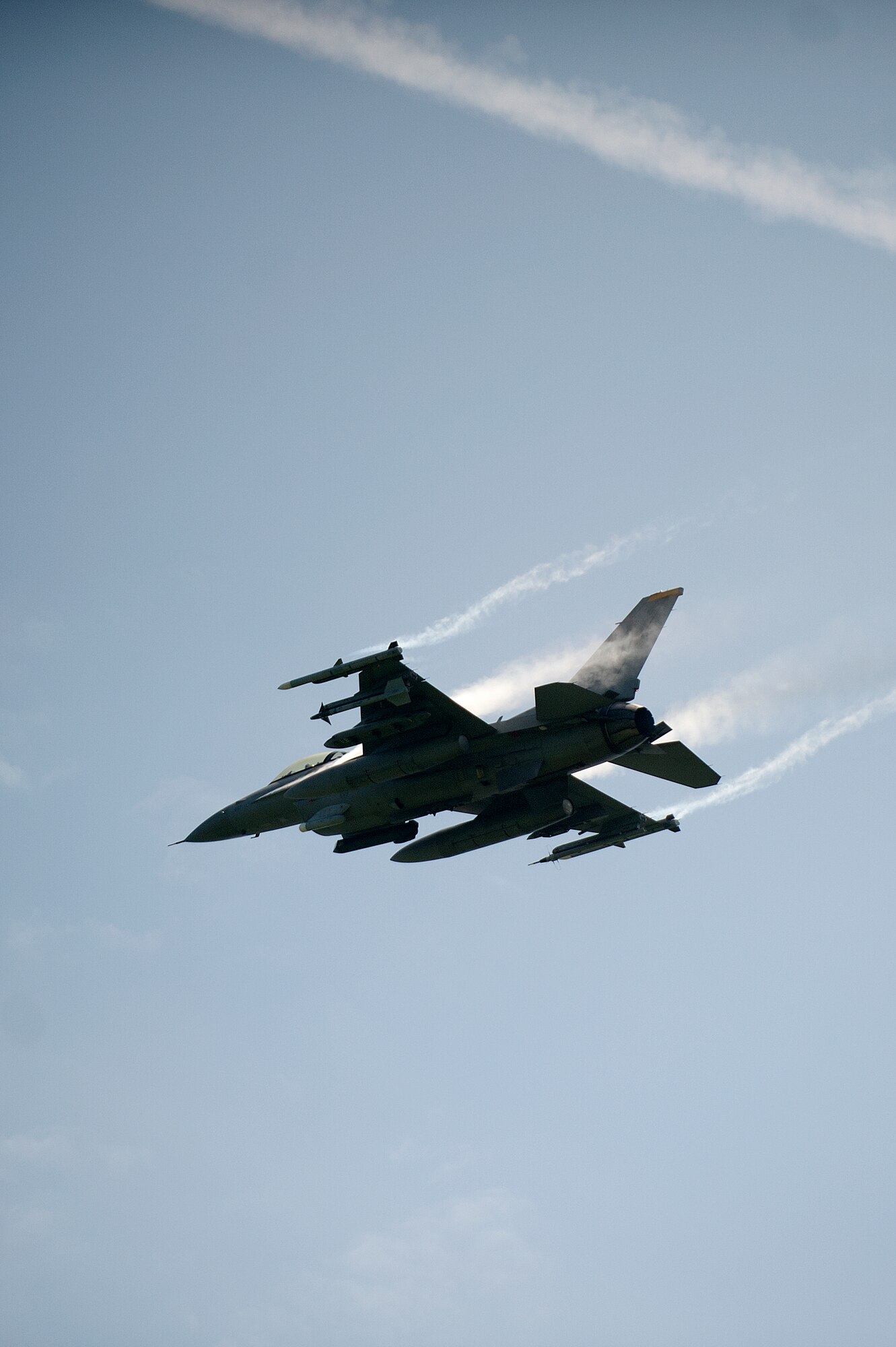 A 14th Fighter Squadron F-16 Fighting Falcon from Misawa Air Base, Japan, flies over Draughon Range during a range day set aside for 35th Fighter Wing community, July 18, 2014. Pilots fly as low as 75 feet and upwards of 20,000 feet to practice their aerial bombing precision.  (U.S. Air Force photo/ Staff Sgt. Tong Duong)