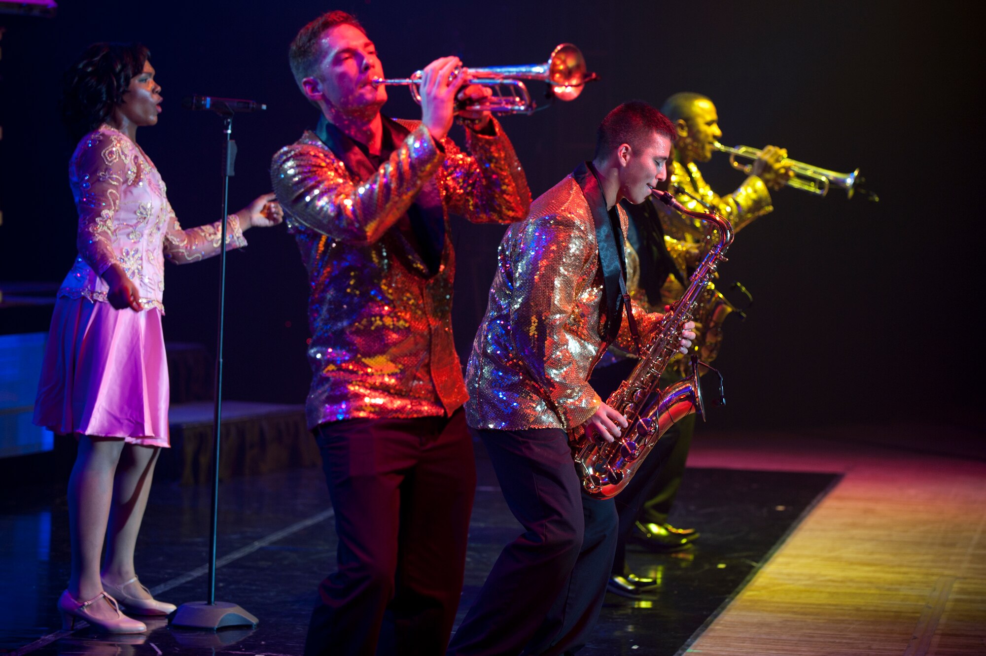 TOPS IN BLUE members entertain Misawa Air Base Airmen, families and Japanese local nationals during a performance at the Misawa Civic Center in Misawa, Japan, July 25, 2014. The group is comprised of active duty Airmen and performs more than 86 shows in 75 locations around the world every year to entertain service members and their families. (U.S. Air Force photo/ Staff Sgt. Tong Duong)
