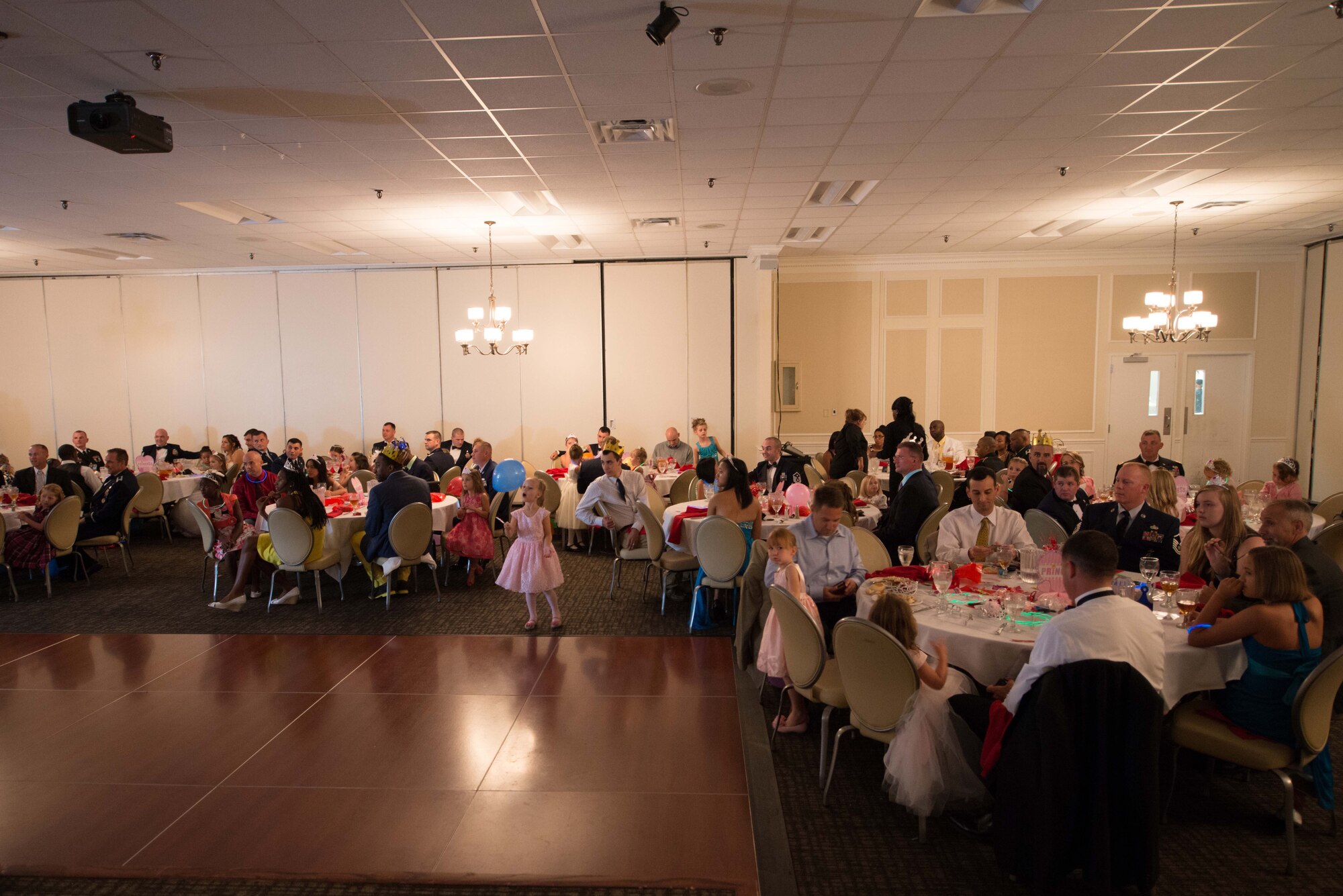 A Carolina Skies Club and Conference center room is filled for the father daughter princess ball at Shaw Air Force Base, S.C., July 12, 2014. The father and daughter dance is counter part to the mother and son dance that was held on May 12. (courtesy photo) 


 
