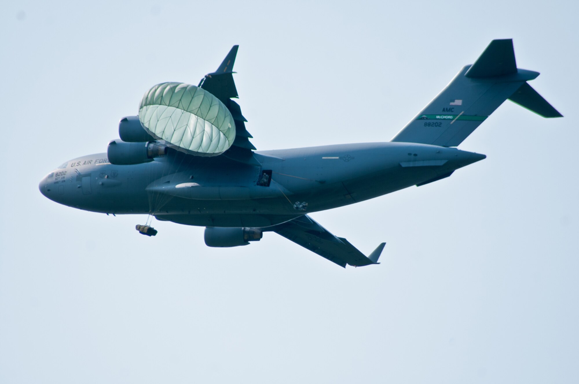 Paratroopers with the 4th Infantry Brigade Combat Team (Airborne), 25th Infantry Division, jump from a U.S. Air Force C-17 Globemaster onto Malemute Drop Zone during a training parachute assault on Joint Base Elmendorf-Richardson, Alaska, July 21, 2014. More than 400 paratroopers and equipment will fill the skies each day over Malemute through Wednesday as part of a partnership training event with members of the U.S. Air Force from Joint Base Lewis-McChord, Wash. and Joint Base Pearl Harbor-Hickam, Hawaii. (Photo by U.S. Army Sgt. Eric-James Estrada)