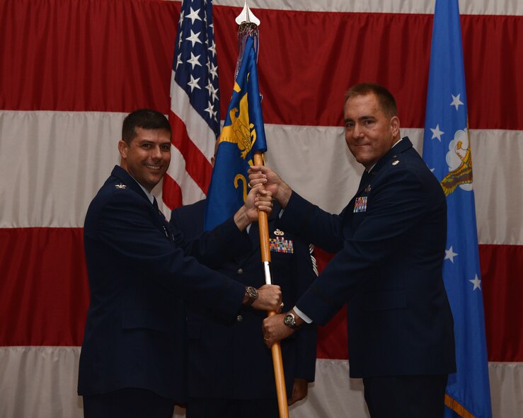 Lt. Col. Craig Harding assumes command of the 2nd Mission Support Group from Col. Andrew Gebara, 2nd Bomb Wing commander, during a change of command ceremony at Barksdale Air Force Base, La., July 28, 2014. Harding was recently a student at the National War College, Fort McNair, District of Columbia. Harding has achieved many accolades during his Air Force career, and plans on continuing the success of the six squadrons he will command. (U.S. Air Force photo/Senior Airman Benjamin Gonsier)