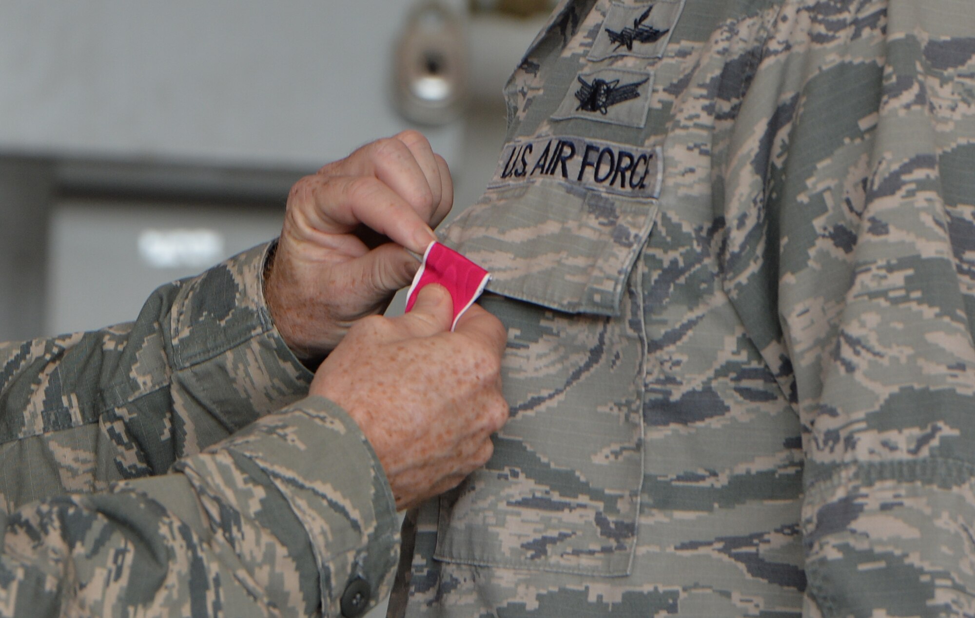 Col. Bill West, 1st Special Operations Wing commander, presents the Legion of Merit award to Col. Douglas Dudley, outgoing 1st Special Operations Mission Support Group Commander, during a change of command ceremony on Hurlburt Field, Fla., July 28, 2014. Col. Todd Fogle assumed command of the 1st SOMSG. (U.S. Air Force photo/Senior Airman Christopher Callaway) 